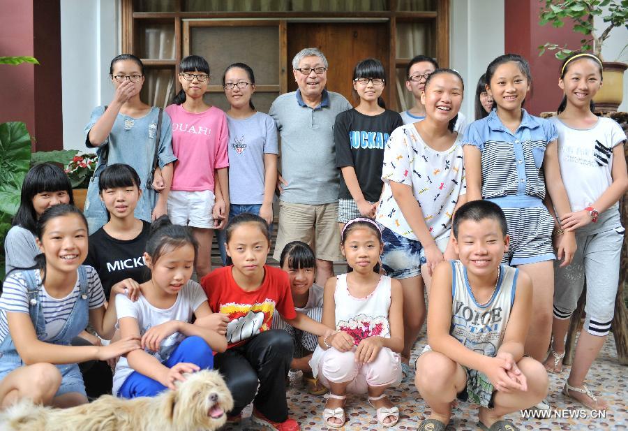 A photo taken on July 16, 2015 shows Professor Lin Nien-sheng, a Taiwan compatriot and students of his free country school in Houjiao Village of Putian City, southeast China's Fujian Province, July 16, 2015.