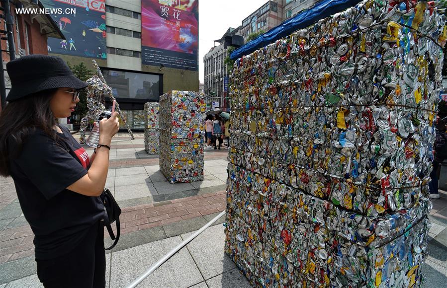 Artworks made of compressed cans displayed in streets of Taipei