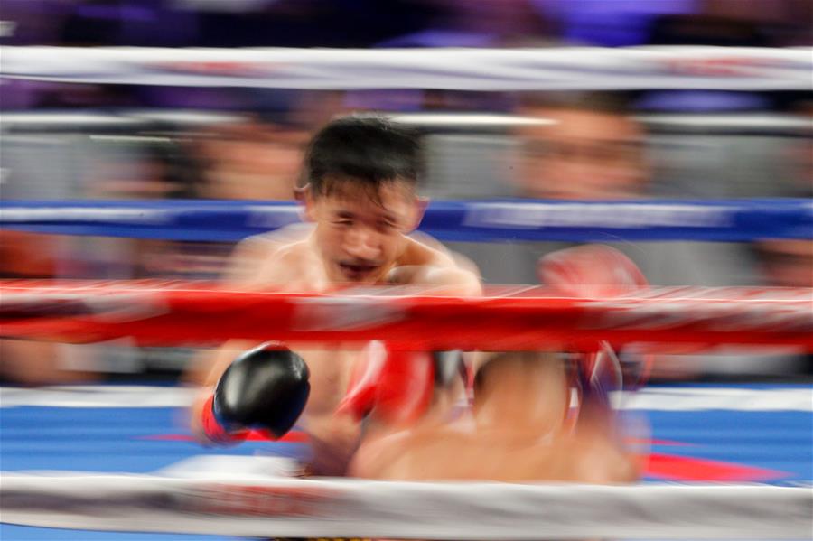 Zou Shiming wins Jozef Ajtai during WBO flyweight title boxing match