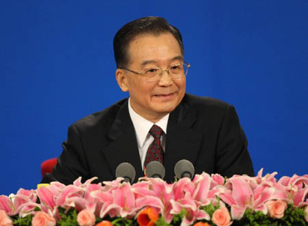 Chinese Premier Wen Jiabao answers questions on a press conference after the closing ceremony of the First Session of the 11th National People's Congress (NPC) at the Great Hall of the People in Beijing, capital of China, March 18, 2008. The annual NPC session closed on Tuesday.
