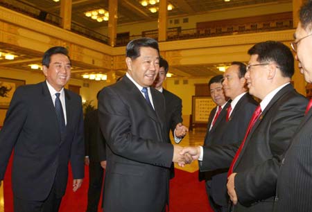Jia Qinlin (2nd L), chairman of the National Committee of the Chinese People's Political Consultative Conference, meets with representatives of the Association of Taiwan Investment Enterprises on the Mainland (ATIEM), in Beijing, capital of China, June 2, 2008.