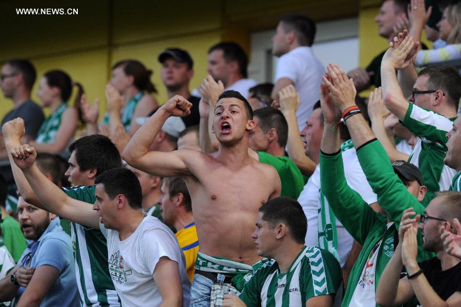 Fans of Zalgiris cheer during the second leg of the second qualifying round of UEFA Champions League between Zalgiris and Dinamo Zagreb in Vilnius, Lithuania, on July 22, 2014. Dinamo Zagreb won the match 2-0.