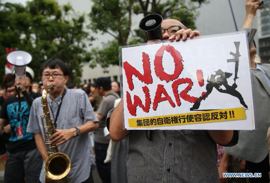 Thousands protest against Japan's Abe, collective defense